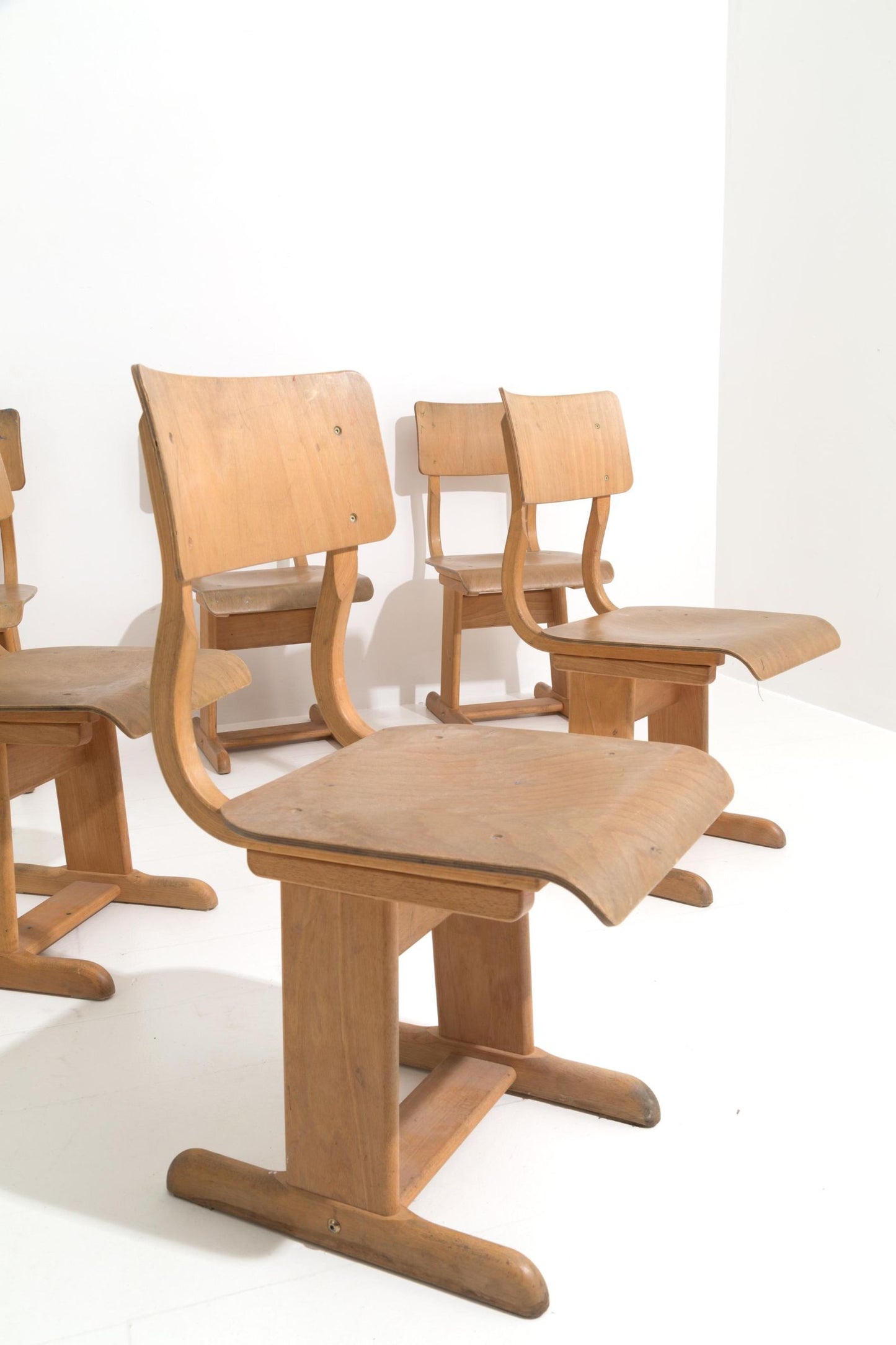 Six wooden school chairs. '50s