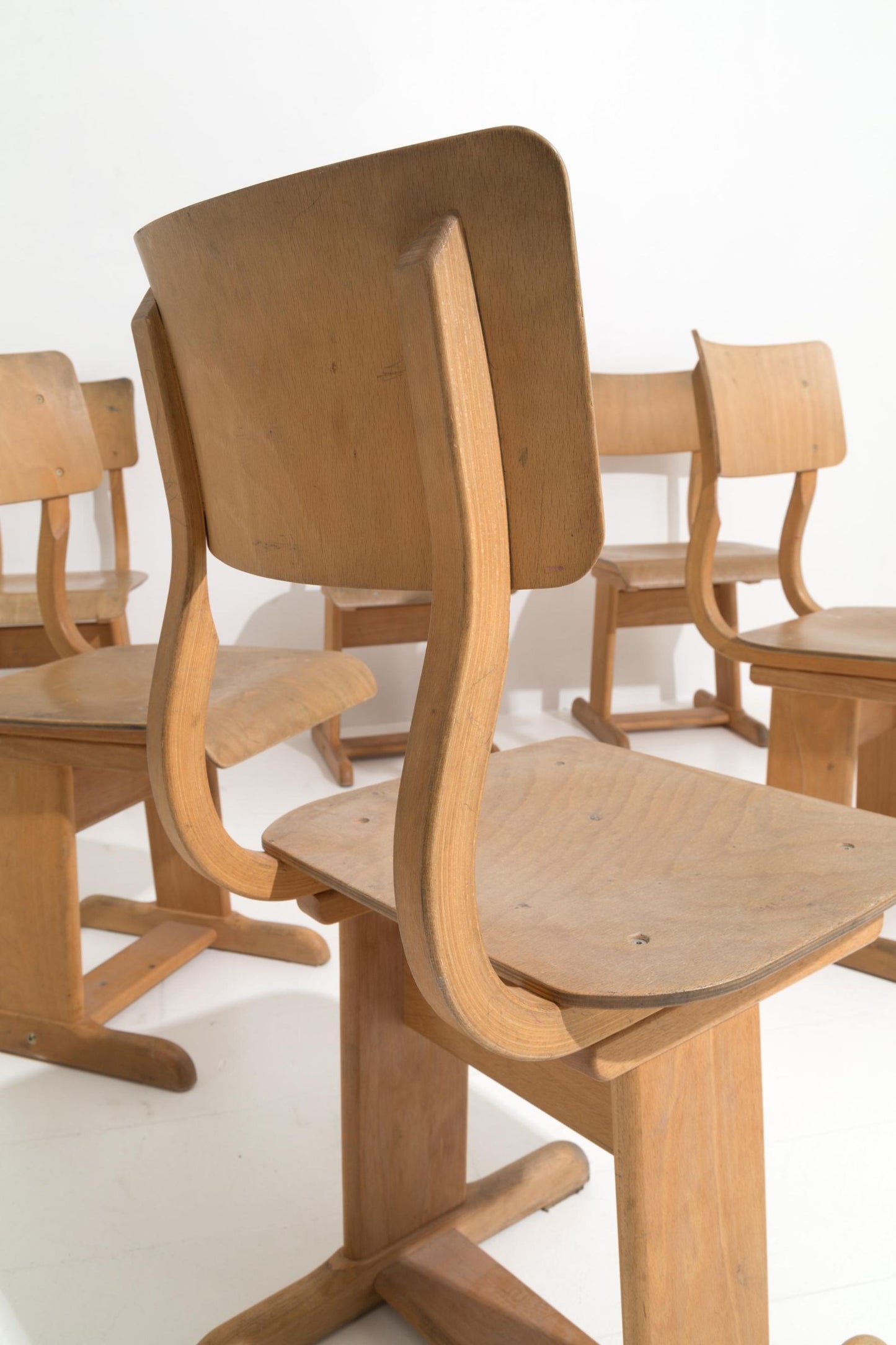 Six wooden school chairs. '50s